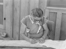 Mrs. Cates signs chattel mortgage with "X", Malheur County, Oregon, 1939. Creator: Dorothea Lange.