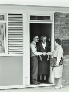 16 Candy Street, Poplar, London: elderly couple greet Welfare Officer, 1962. Creator: Unknown.