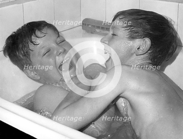 Two boys playing in the bath, Horley, Surrey, c1960-1979(?).