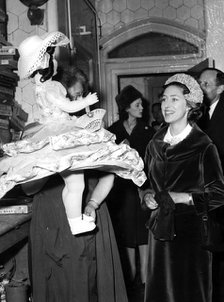 Princess Margaret stops to look at a giant doll, Dr Barnardo's Home, Stepney, London, 1962. Artist: Unknown