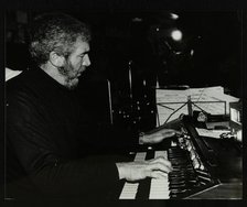 Ron Lohn playing the electronic organ at The Bell, Codicote, Hertfordshire, 22 February 1981. Artist: Denis Williams