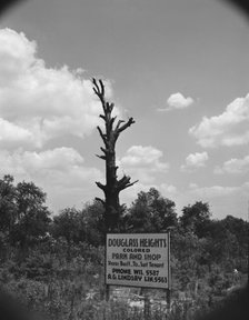 Sign on Alabama Avenue, Frederick Douglass housing project, Anacostia, D.C (vicinity), 1942. Creator: Gordon Parks.