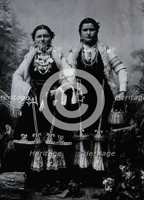 Two Bulgarian women arm-in-arm wearing national dress, c1900. Creator: Unknown.