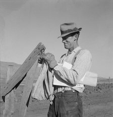 Farmer getting the morning mail, Gem County, Idaho, 1939. Creator: Dorothea Lange.