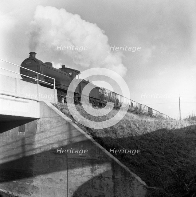 Steam loco no 65794 hauling coal from Lynemouth Colliery, Northumberland, 1963.  Artist: Michael Walters