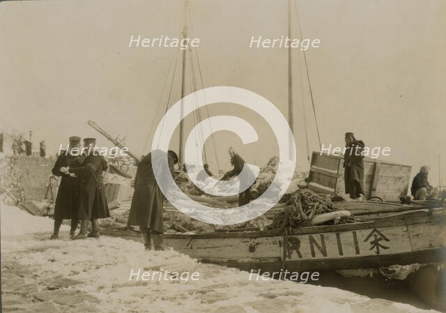 Japanese officers directing the unloading of supplies, Chemulpo, c1904. Creator: Robert Lee Dunn.