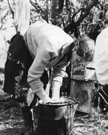 Woman doing the washing, Charlwood, Surrey, 1960s(?).