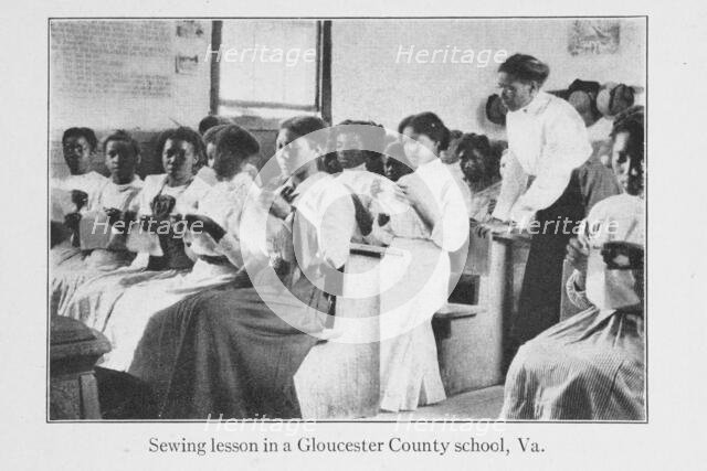 Sewing lesson in a Gloucester County school, Va., 1915. Creator: Unknown.