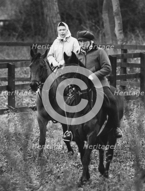Queen Elizabeth II and Princess Anne riding through Anmer Village, near Sandringham, 1981. Artist: Unknown