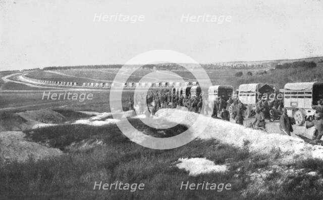 'Au Volant; Sur une route strategique, a proximite de la ligne de feu: releve de troupes par...,1918 Creator: Unknown.