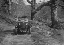 Kitty Brunell road testing a Riley 9 WD tourer, c1930. Artist: Bill Brunell.