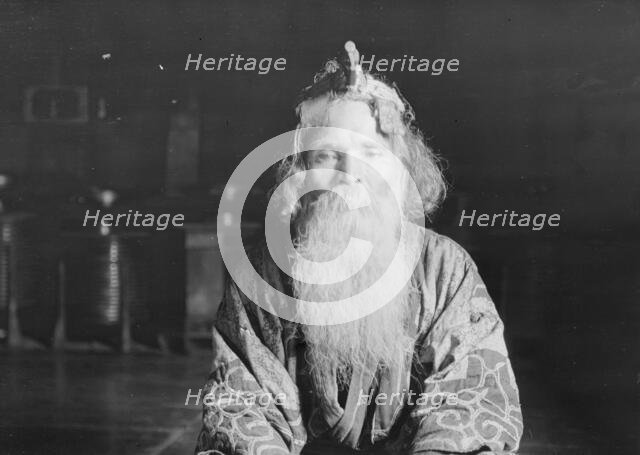 Ainu chief wearing a headdress, 1908. Creator: Arnold Genthe.