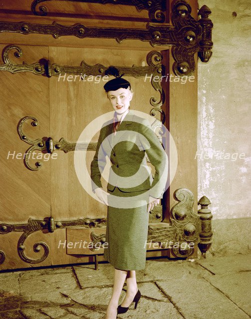 Female model shows a suit, the Historical Museum, Stockholm, 1950s. Artist: Göran Algård