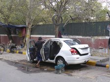 Car washing in Delhi. Creator: Unknown.