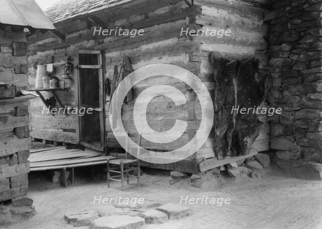 Construction detail of double log cabin of Negro share tenants, Person County, North Carolina, 1939. Creator: Dorothea Lange.
