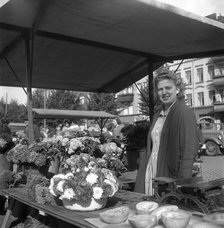 Woman on her flower stall in the market, Malmö, Sweden, 1947. Artist: Otto Ohm