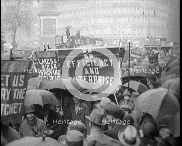 Civilians Demonstrating in London Against Continuous Strikes in the Rain. Signs Read..., 1926. Creator: British Pathe Ltd.