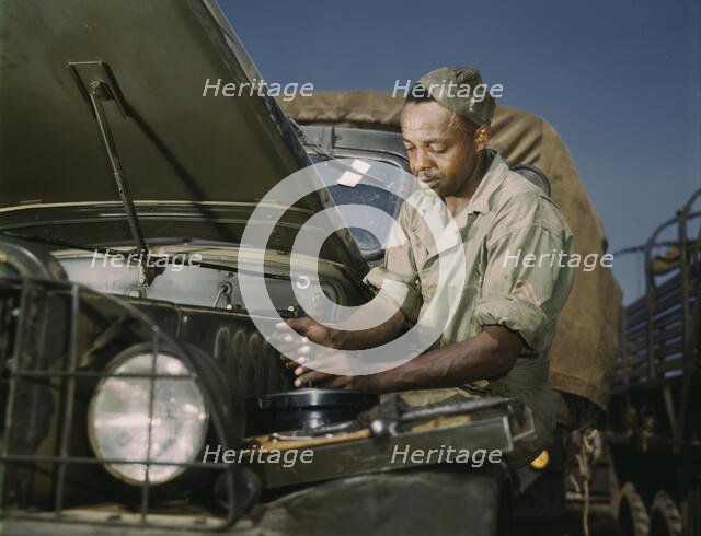 Colored mechanic, motor maintenance section, Ft. Knox, Ky., 1942. Creator: Alfred T Palmer.