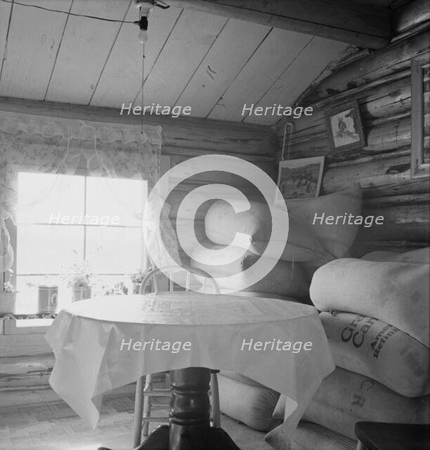 Interior of farmer's two-room log home, FSA borrower, Boundary County, Idaho, 1939. Creator: Dorothea Lange.