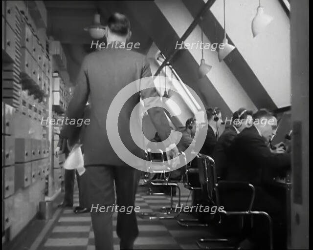 Man Entering Office at BBC Broadcasting House, 1936. Creator: British Pathe Ltd.