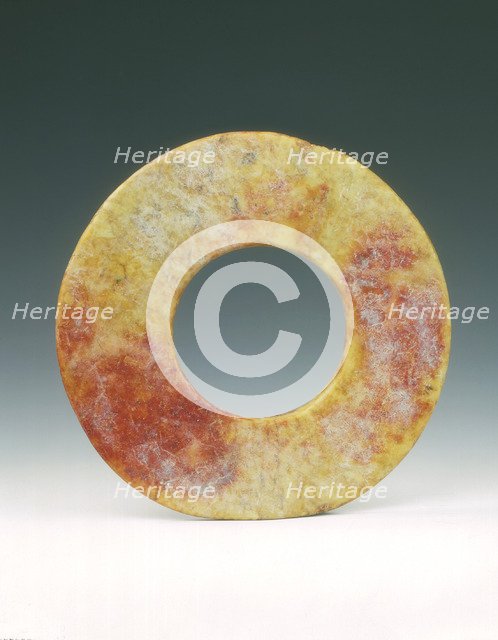 Altered jade bi-disc with russet patches, Neolithic, Liangzhu culture, China, c3400-c2250 BC. Artist: Unknown