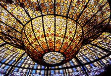 Detail of the Modernist stained glass window in the roof of the Palau de la Música Catalana in Ba…