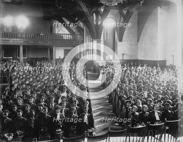 Interior view of chapel filled with female students at the Tuskegee Institute, c1902. Creator: Frances Benjamin Johnston.