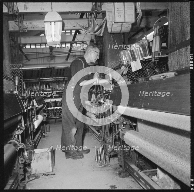 Weaver operating a Jacquard power loom, 1966-1974. Creator: Eileen Deste.