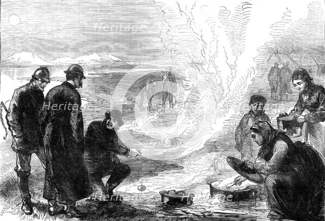 The Tourist in Iceland: on the road to the geysirs - boiling eggs in the hot springs, 1881. Creator: Unknown.