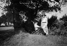 A physically disabled boy sitting in a wheelchair,  c1910/1925. Creator: Unknown.