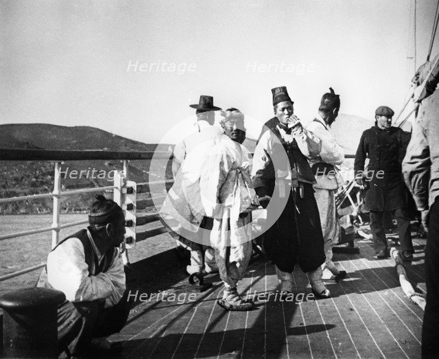 Japanese officials on board a ship, Korea, 1900. Artist: Unknown