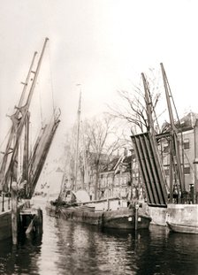 Canal bridge and boats, Dordrecht, Netherlands, 1898.Artist: James Batkin