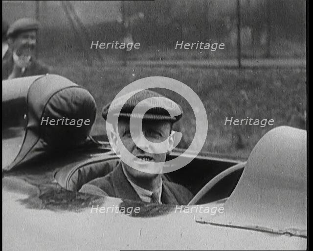 Sir Henry Segrave AKA Major Segrave's Climbing Into 'Sunbeam' Watched By a Crowd of Civilians, 1927. Creator: British Pathe Ltd.