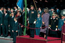 Juan Carlos I, King of Spain, with Queen Sofia and Prince Felipe, presiding over a military parad…