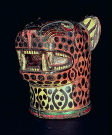 Kero or carved wood vase, jaguar head shaped, in polychromed wood.