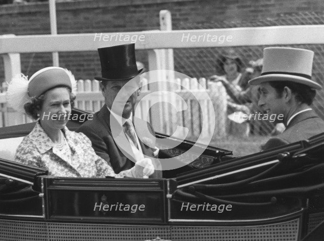 The Royal party driving down the course on the first day of Royal Ascot, 17th June 1975.  Creator: Unknown.