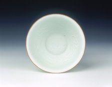 White glazed bowl with moulded design of dragons and carp, Qing dynasty, China, 1650-1670. Artist: Unknown