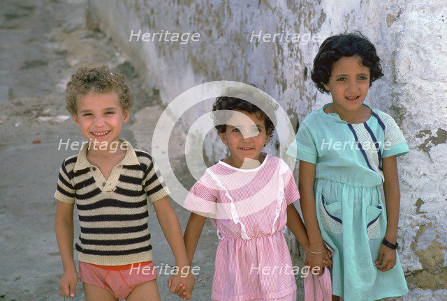 Three children in Kairouan, Tunisia. Artist: Unknown