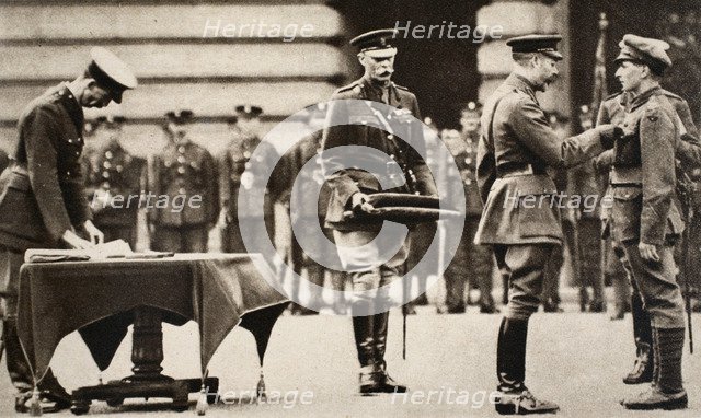 King George V awarding the Victoria Cross to Private Wilfred Edwards, 1917. Artist: Unknown