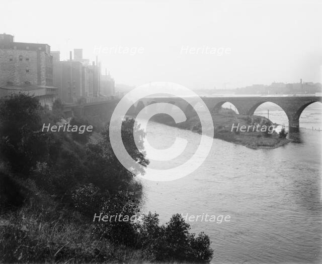 Minneapolis, view from across river, between 1880 and 1899. Creator: Unknown.