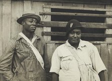 Cotton pickers receiving sixty cents a day, Pulaski County, Arkansas, October 1935. Creators: Farm Security Administration, Ben Shahn.