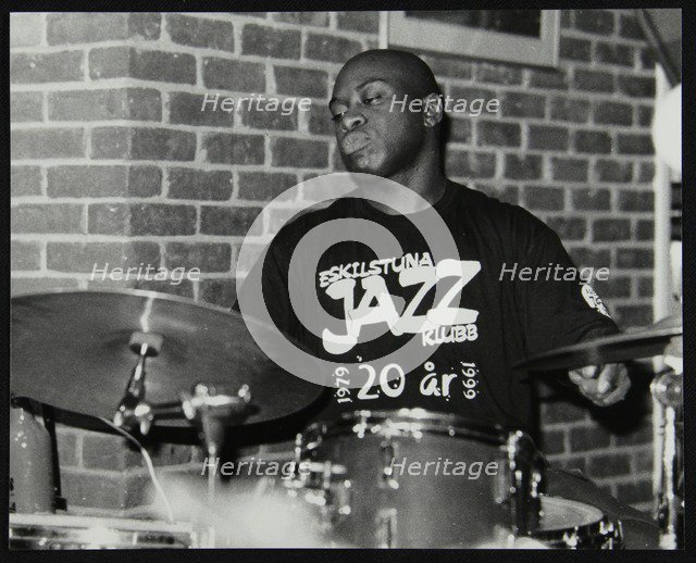 Winston Clifford on drums at The Fairway, Welwyn Garden City, Hertfordshire, 18 February 2001. Artist: Denis Williams