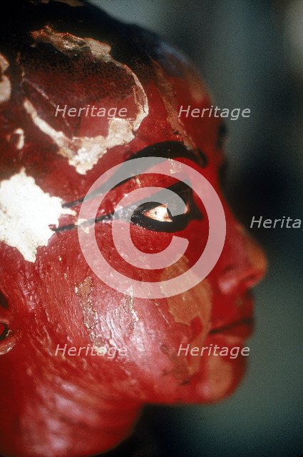 Closeup of head of Tutankhamun as a child emerging from a lotus flower. Artist: Unknown