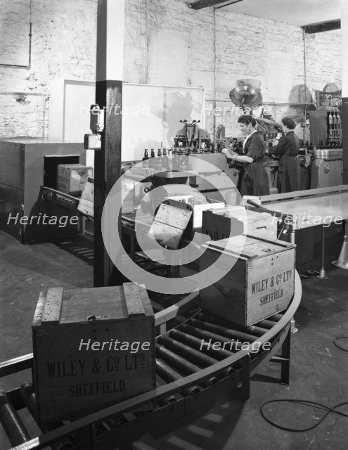 The final stages of bottling whisky at Wiley & Co, Sheffield, South Yorkshire, 1960.  Artist: Michael Walters