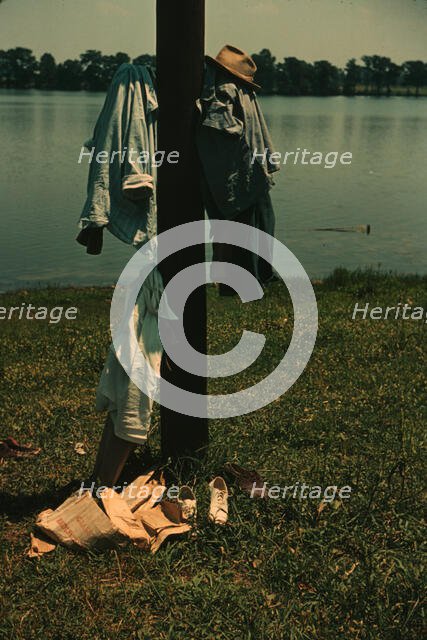 Clothes of swimmers hanging on a telegraph pole, Lake Providence, La., 1940. Creator: Marion Post Wolcott.
