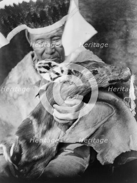 Dancer with black deer effigy-Hupa, c1923. Creator: Edward Sheriff Curtis.