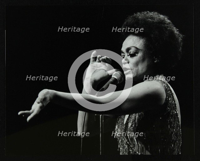 Eartha Kitt performing at the Forum Theatre, Hatfield, Hertfordshire, 20 March 1983. Her concert end Artist: Denis Williams