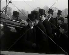 A Group of Young Male British Civilians Admiring an Airplane On an Airfield, 1920s. Creator: British Pathe Ltd.