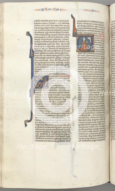 Fol. 354v, Amos, historiated initial V, Amos kneeling in prayer, bust of God above, c. 1275-1300. Creator: Unknown.