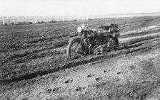 Motorbike in mud, near Dalby, Queensland, 1930. Creator: Jack Bain.